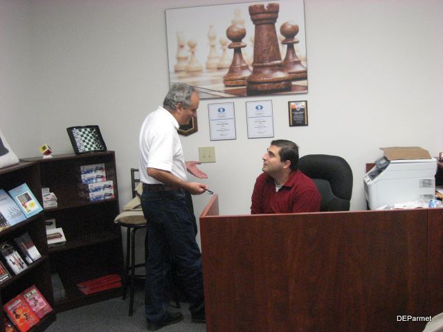 GM Dmitry Gurevich and Sevan Muradian having a pleasant discussion after the team's victory.